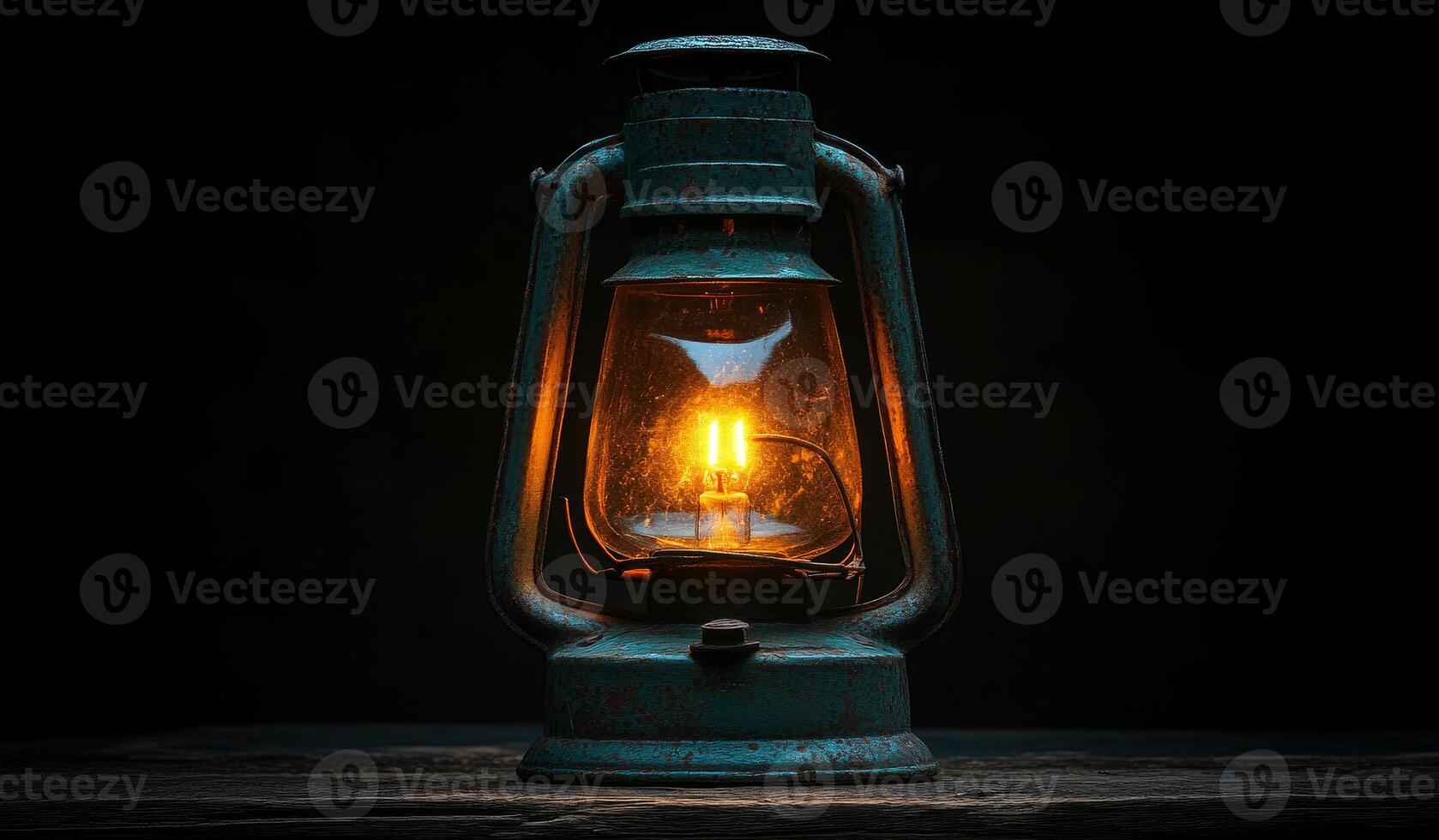 A lantern with a light inside of it is lit up. The lantern is sitting on a wooden surface photo