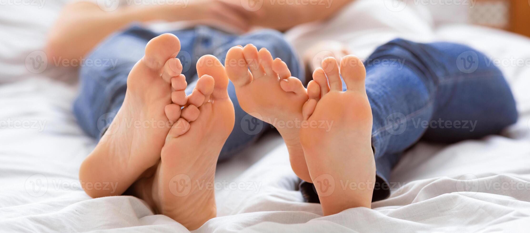 Morning Romance. Affectionate Couple Embracing Lying Together In Bed At Home. Selective Focus, Shallow Depth photo