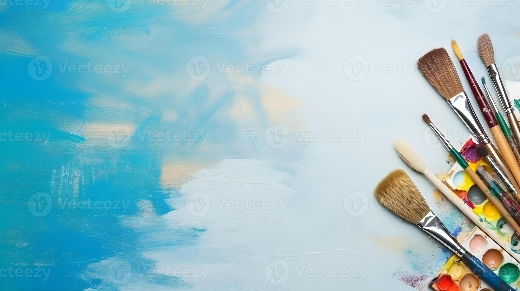Collection of Painting Tools Including Brushes, Spatula, and Roller photo