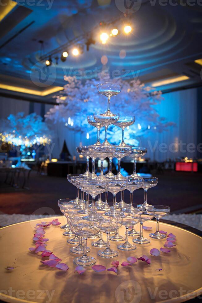 A table with a lot of wine glasses photo