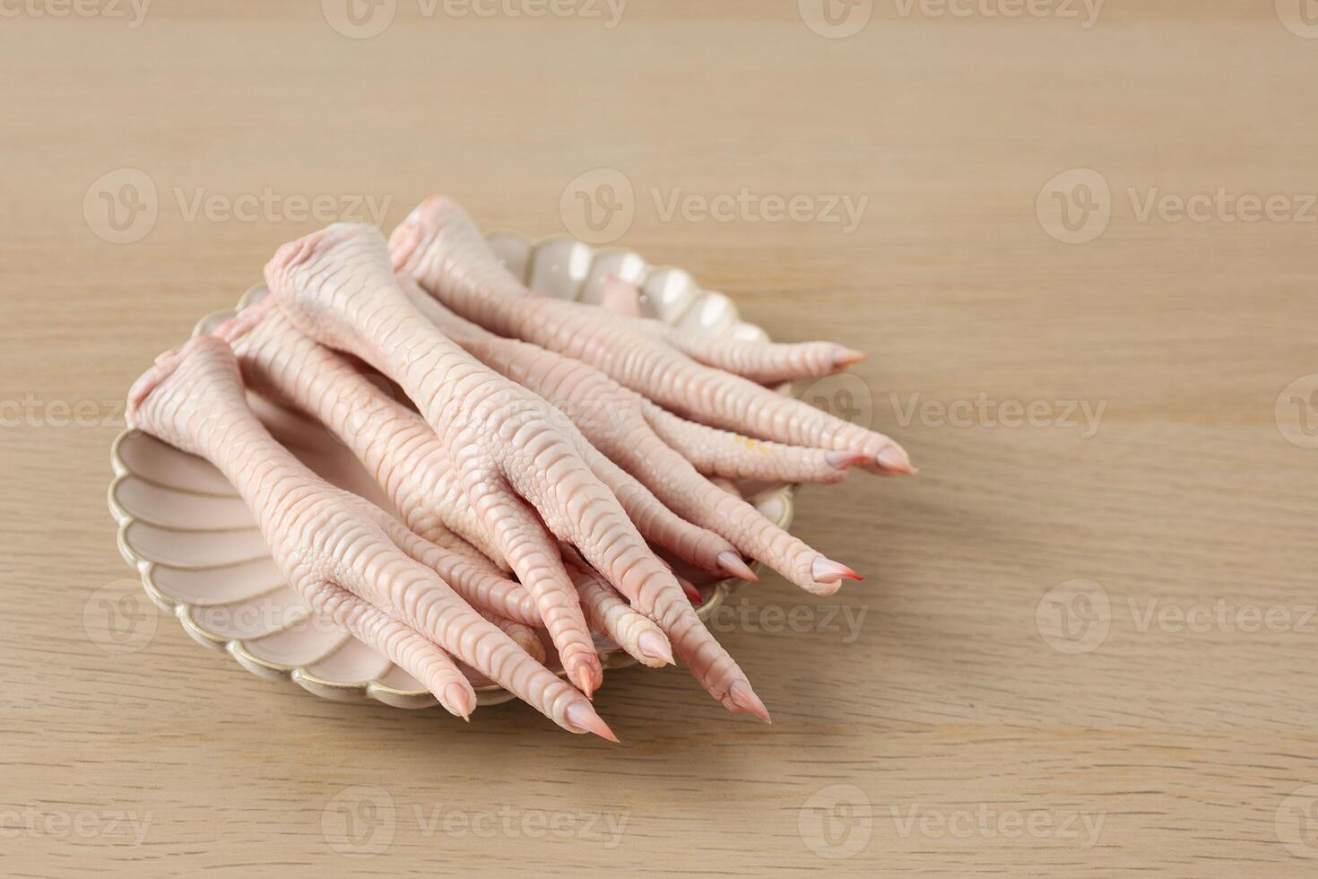 Close Up A Plate of Raw Chicken Feet Claw photo