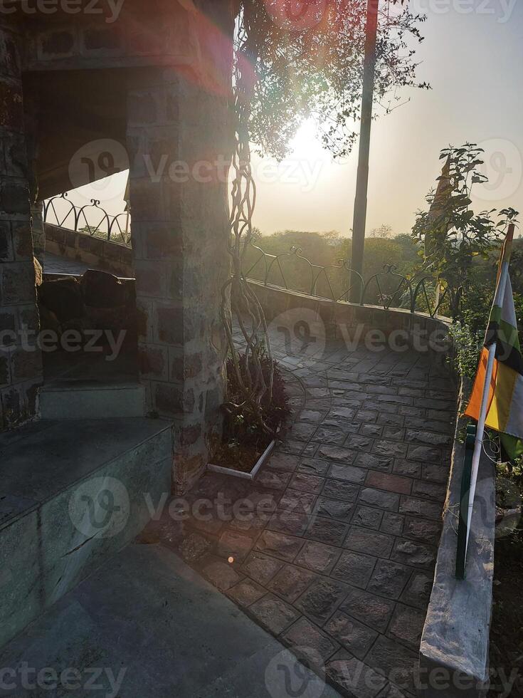 A stone building with a flag pole on top photo