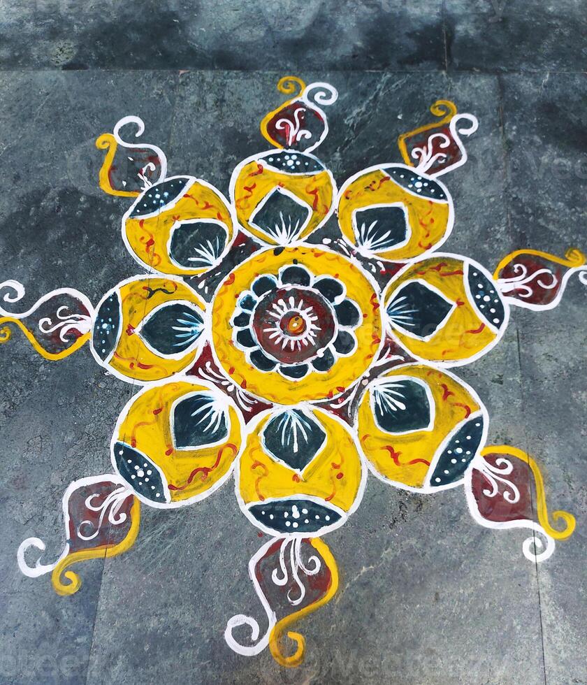 A colorful rangoli on the floor photo