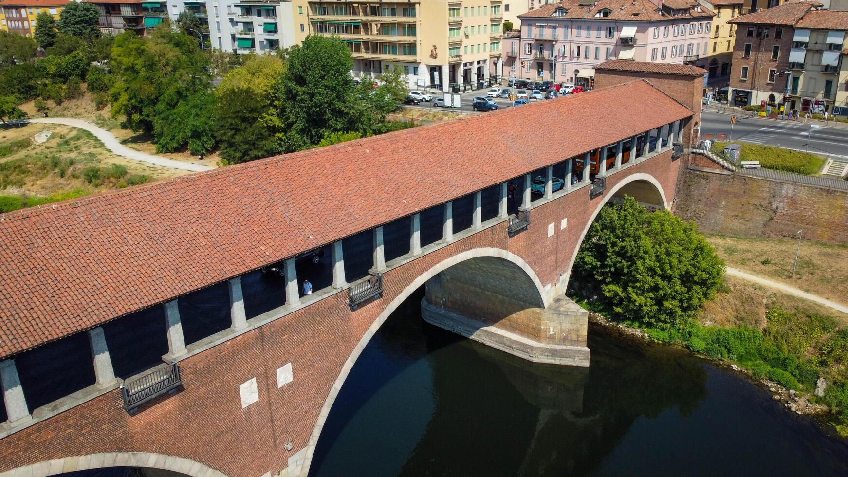 View of Ponte coperto, covered bridge, of Pavia, Italy. Bridge over the Ticino river in the city of Pavia in Lombardy. photo
