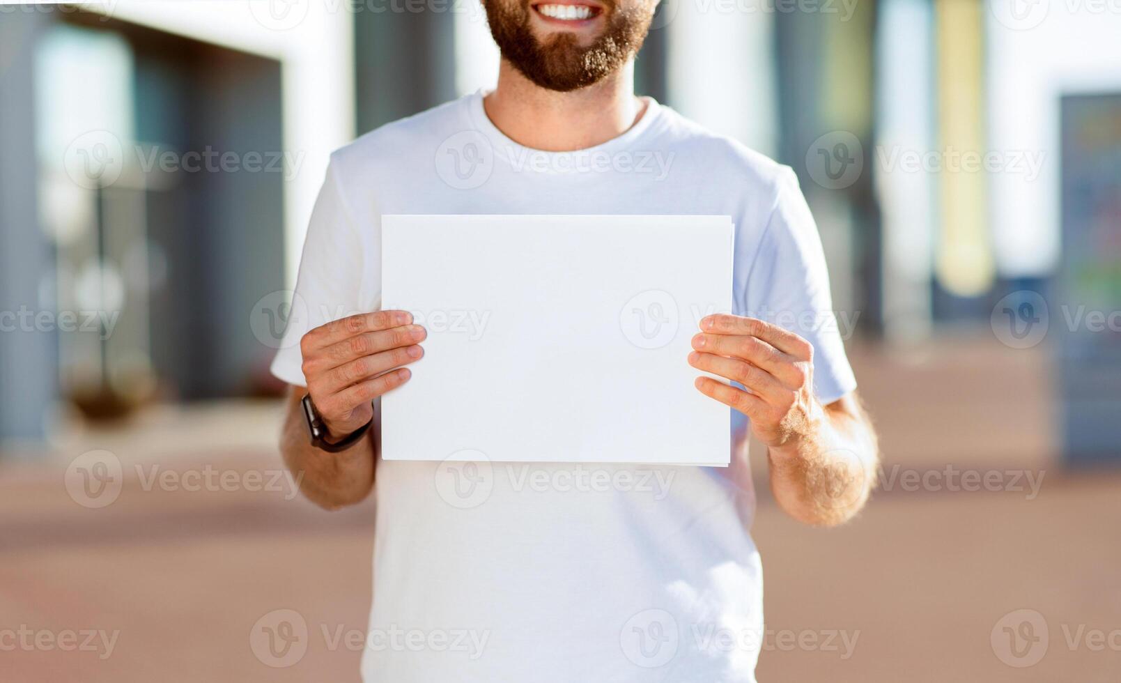 Welcome. Man holding empty signboard at international airport meeting point, receiving travelers at arrival gate photo