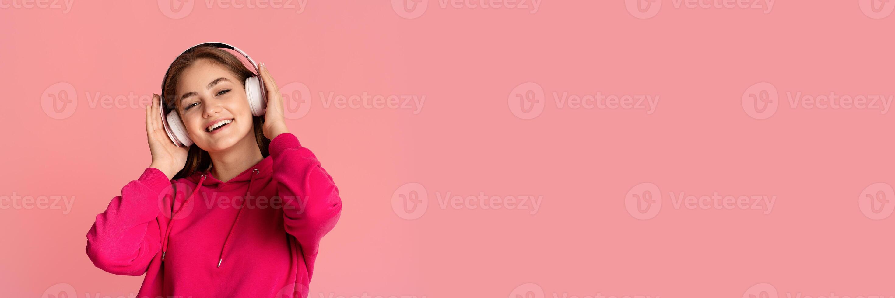 Relax and music. Teen girl in wireless headphones enjoying favorite song, close up, studio shot, copy space photo