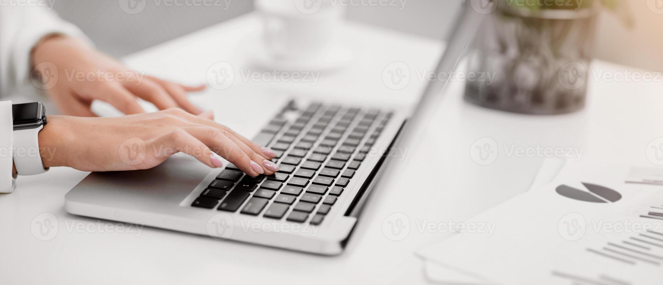 Freelance. Close up of woman using laptop, working at home, writing a blog, hands on keyboard. Copyspace photo