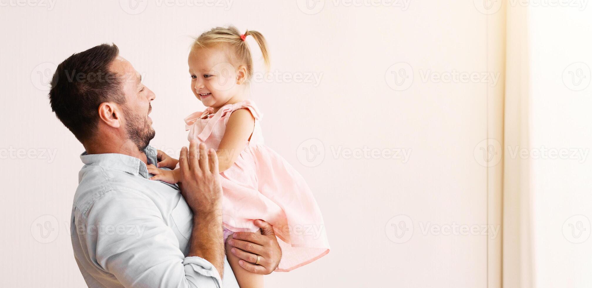 Adopted Child. Happy millennial father hugging his foster child, spending time with daughter. Copy space photo