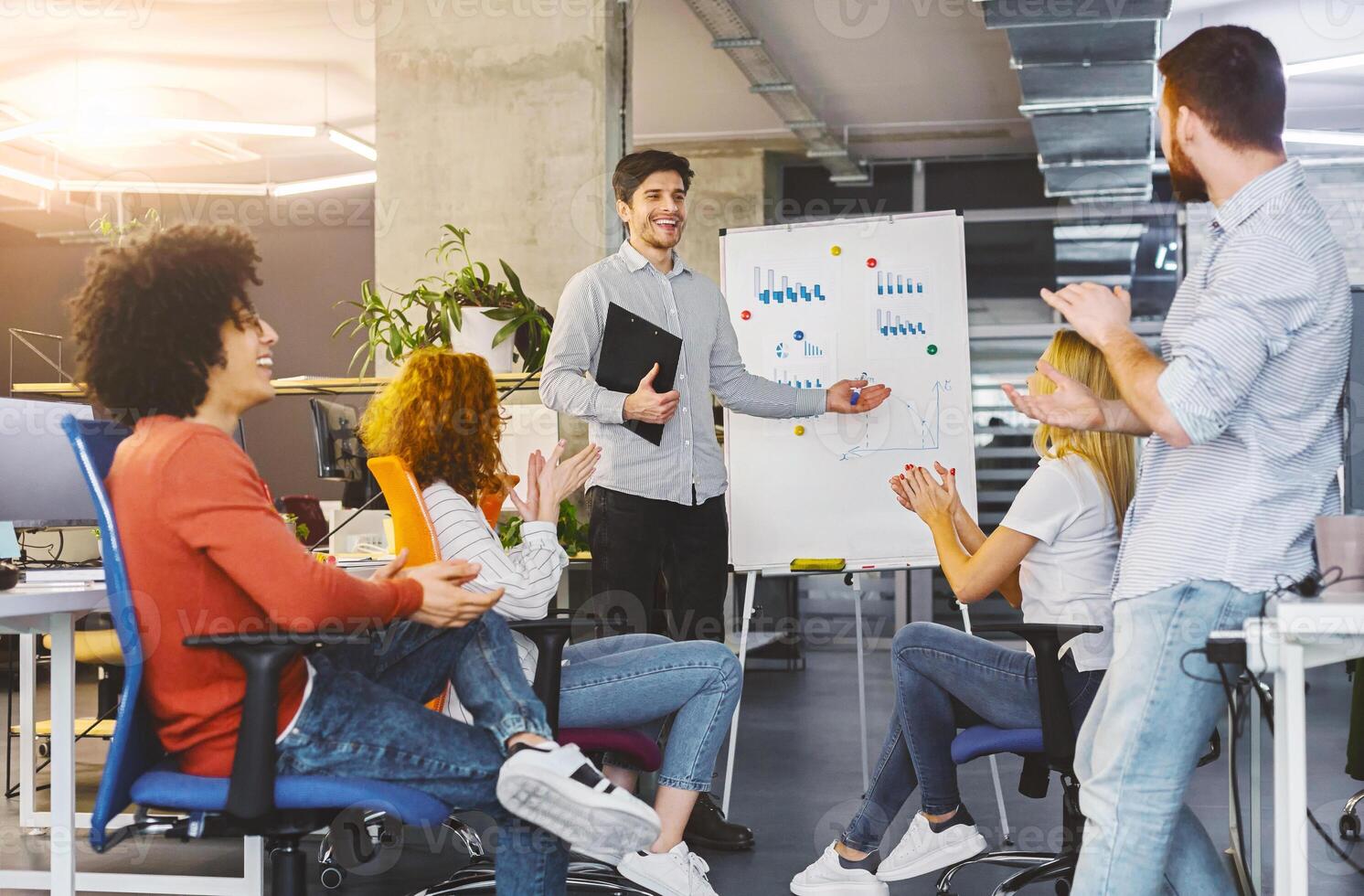 New marketing strategy. Young millennial team analyzing information on graphs and charts on whiteboard in office, free space photo