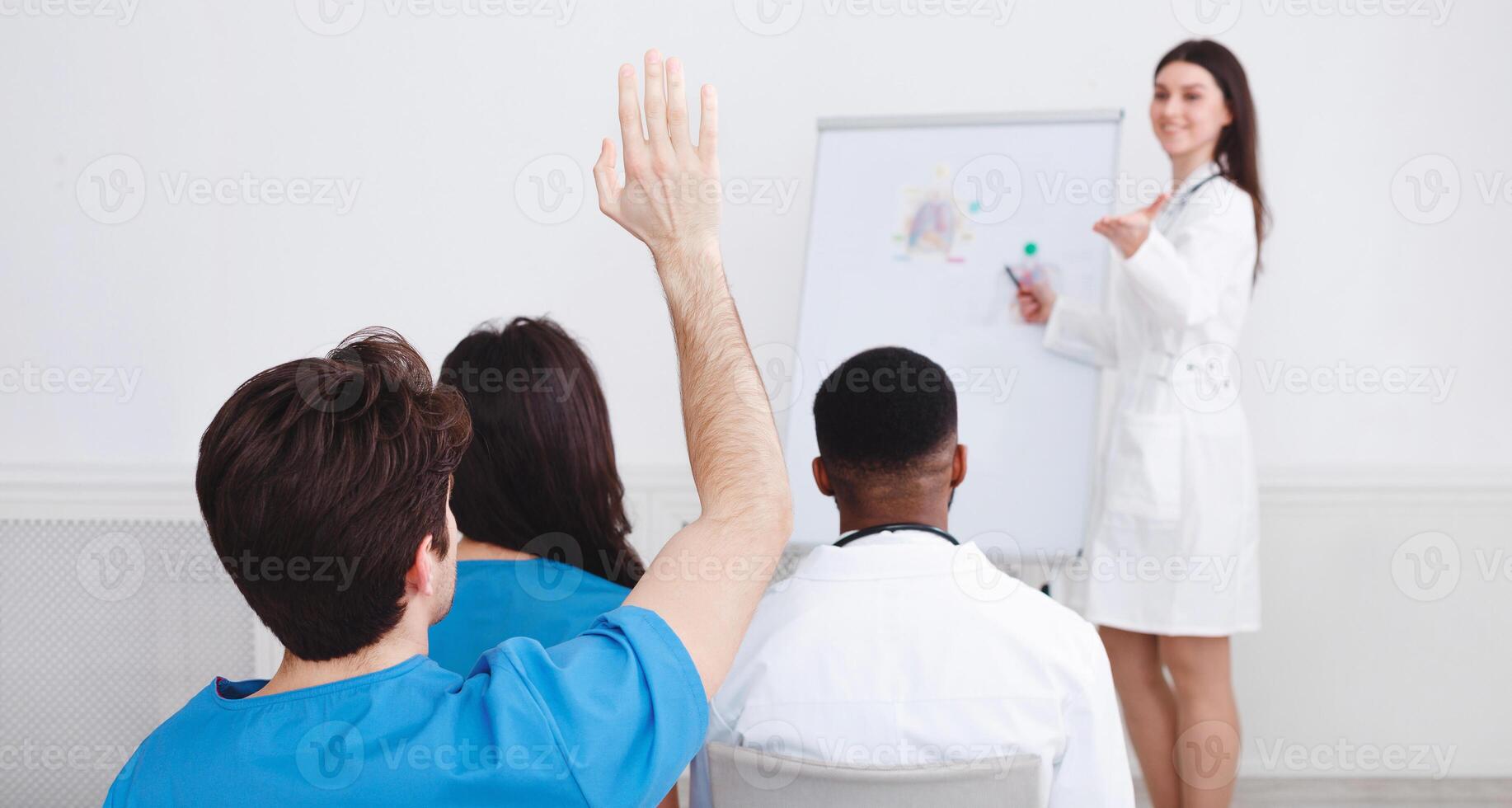 Medical Education. Doctor Giving Lecture, Active Intern Having Question photo