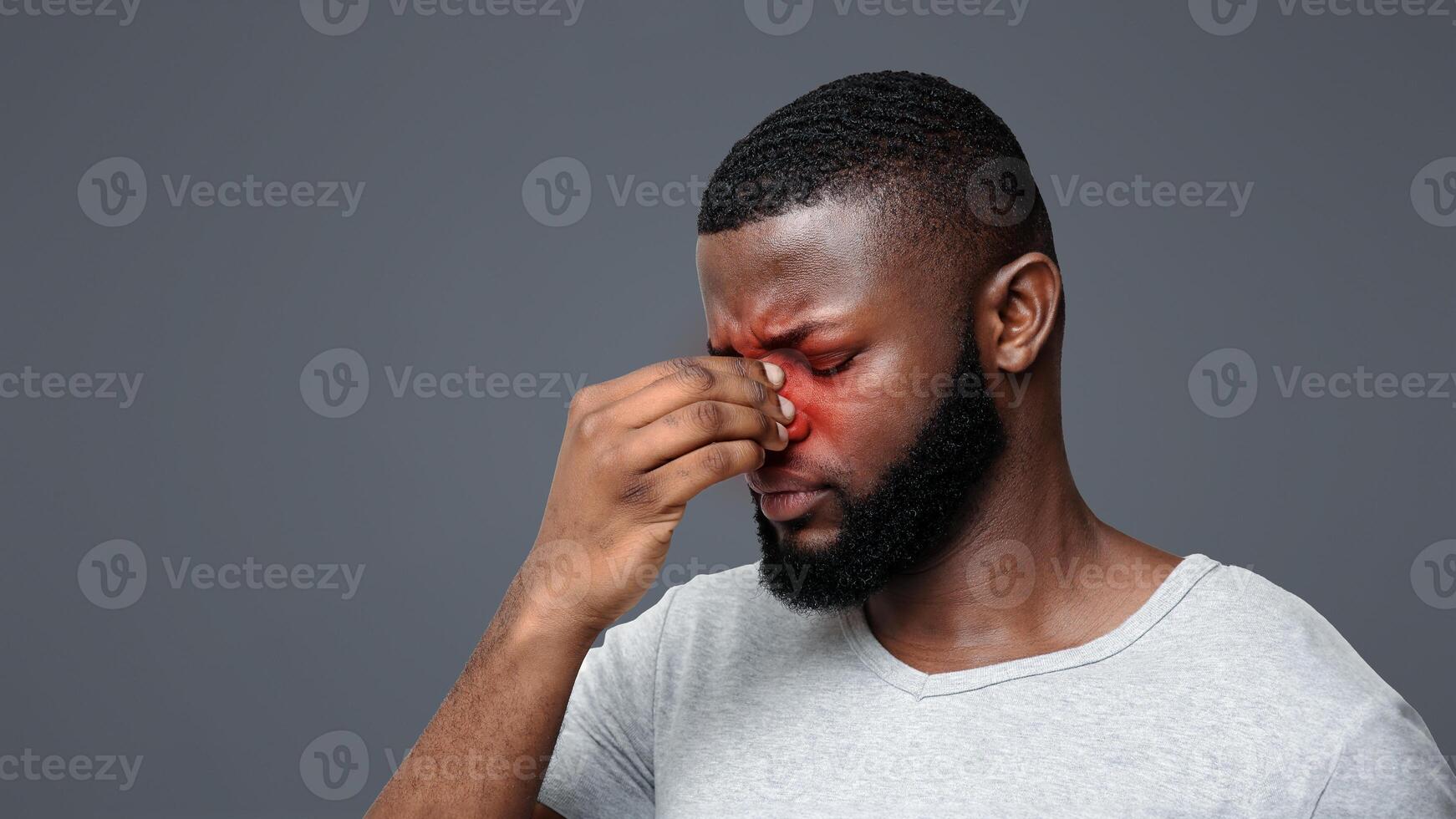 Tired afro man touching his nose bridge, suffering from eye pain, tired eyes, copy space photo