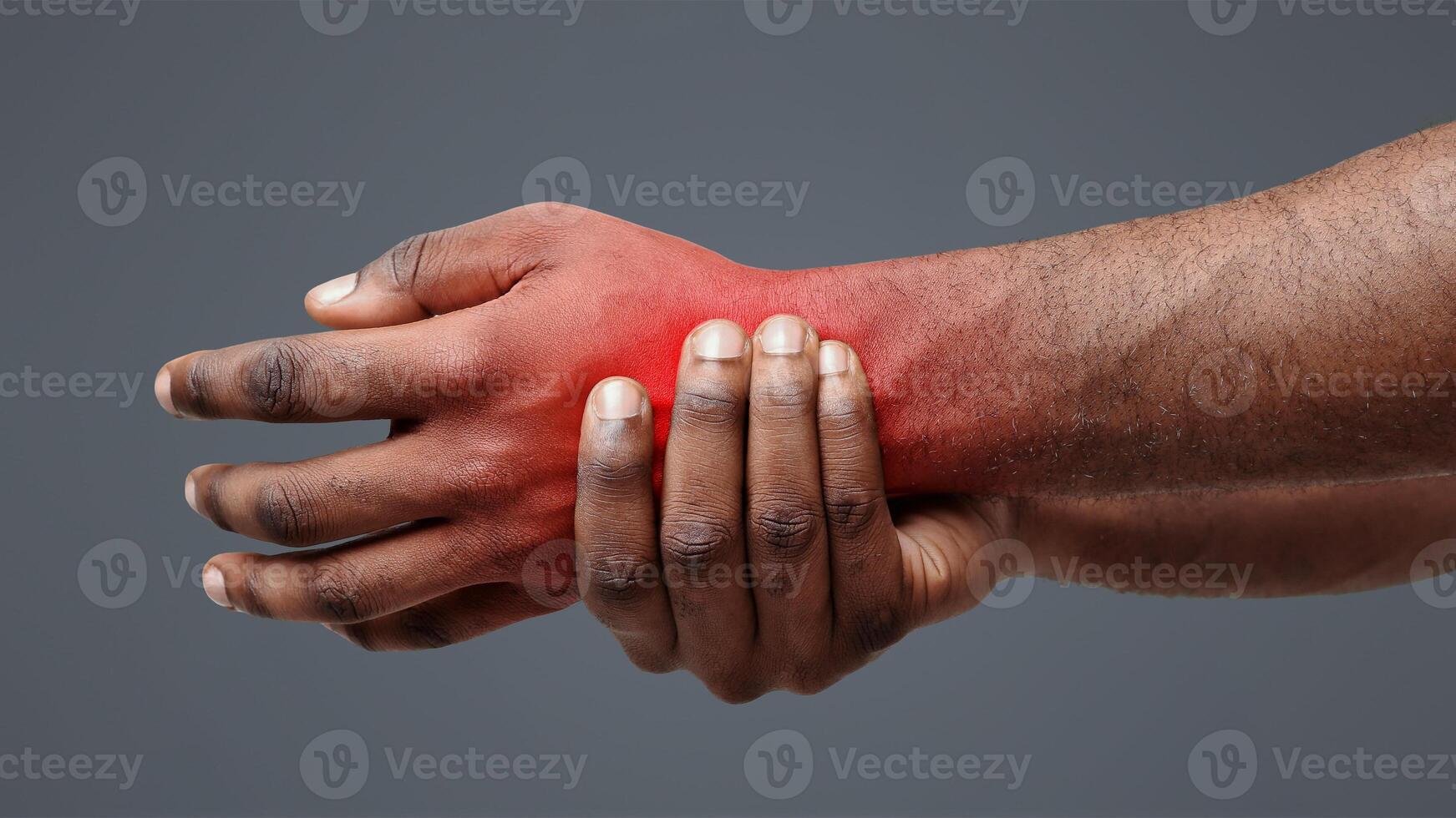 Close up of afro man suffering from rheumatism, massaging his wrist over white background photo