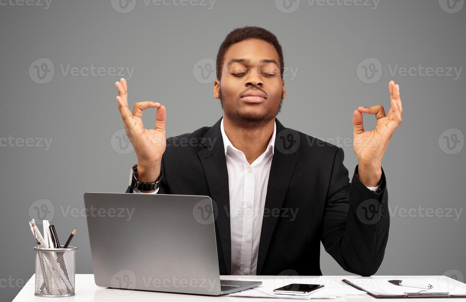 Relaxation At Work. Afro businessman meditating at work, dealing with stress and anxiety. Free space photo