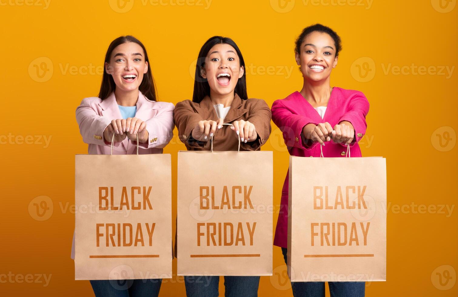 Shopping Concept. Three Happy Women Showing Blank Shopper Bags Standing On Yellow Background. Mockup, Studio Shot photo