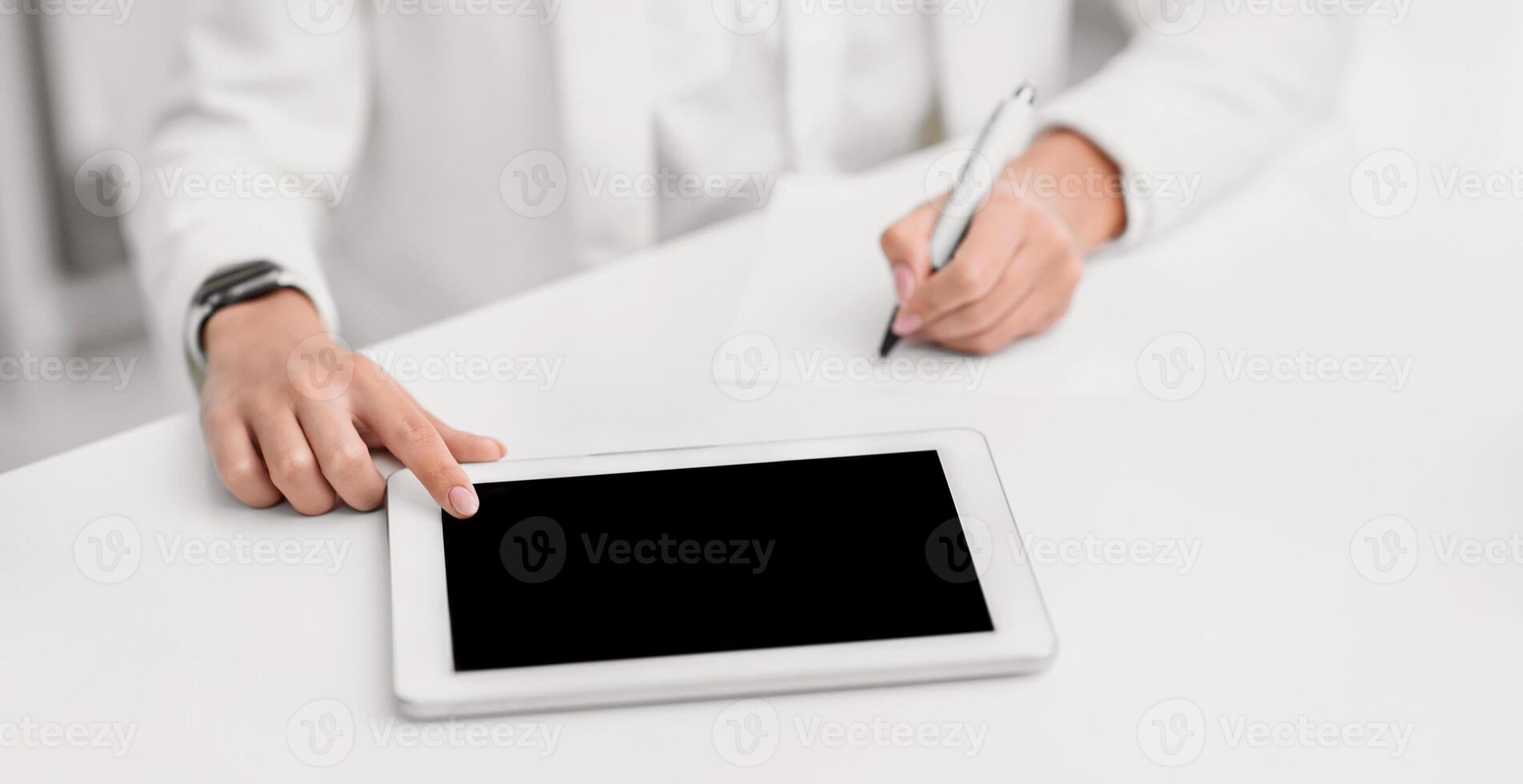 Writing Ideas. Unrecognizable woman using touch tablet and taking notes. Mock up photo