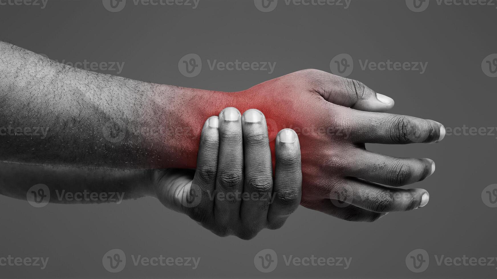 Close up of afro man suffering from rheumatism, massaging his wrist over white background photo