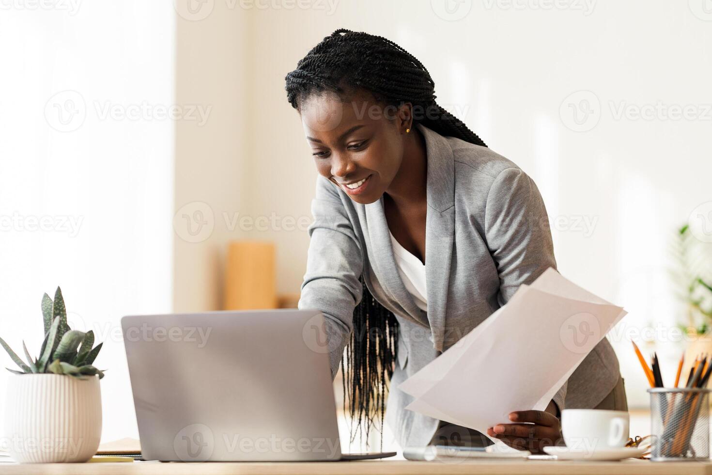 Successful Project. Smiling Afro Business Lady Working With Papers And Laptop In Modern Office, Free Space photo