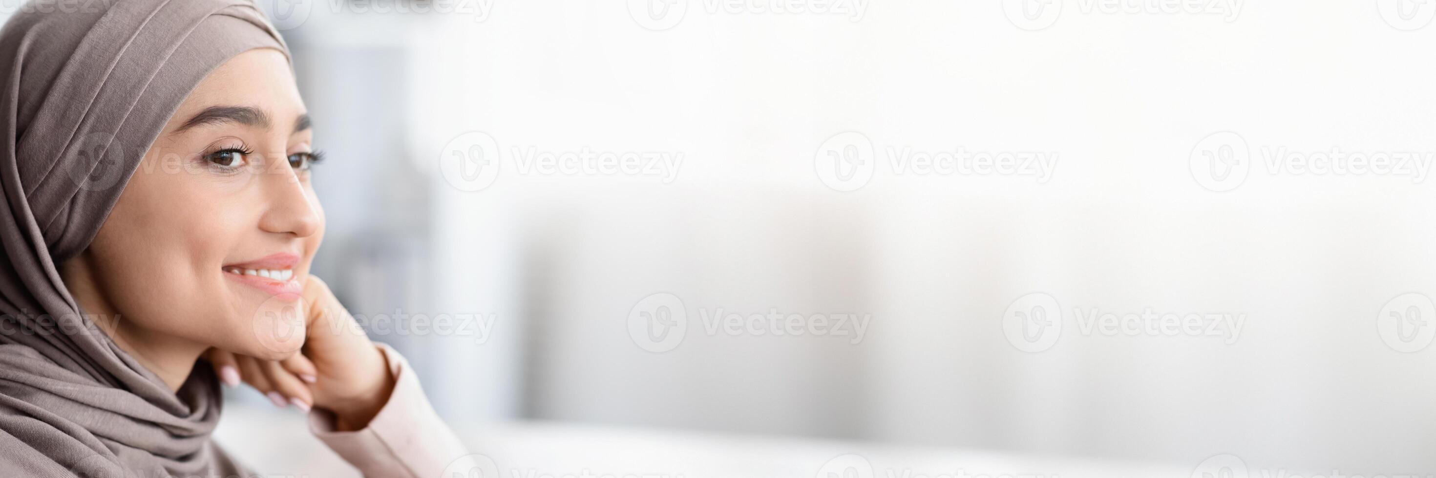 Future Business Leader. Closeup Portrait Of Smiling Arabic Woman In Hijab Resting Head On Hand And Looking Away, Selective Focus, Copy Space photo