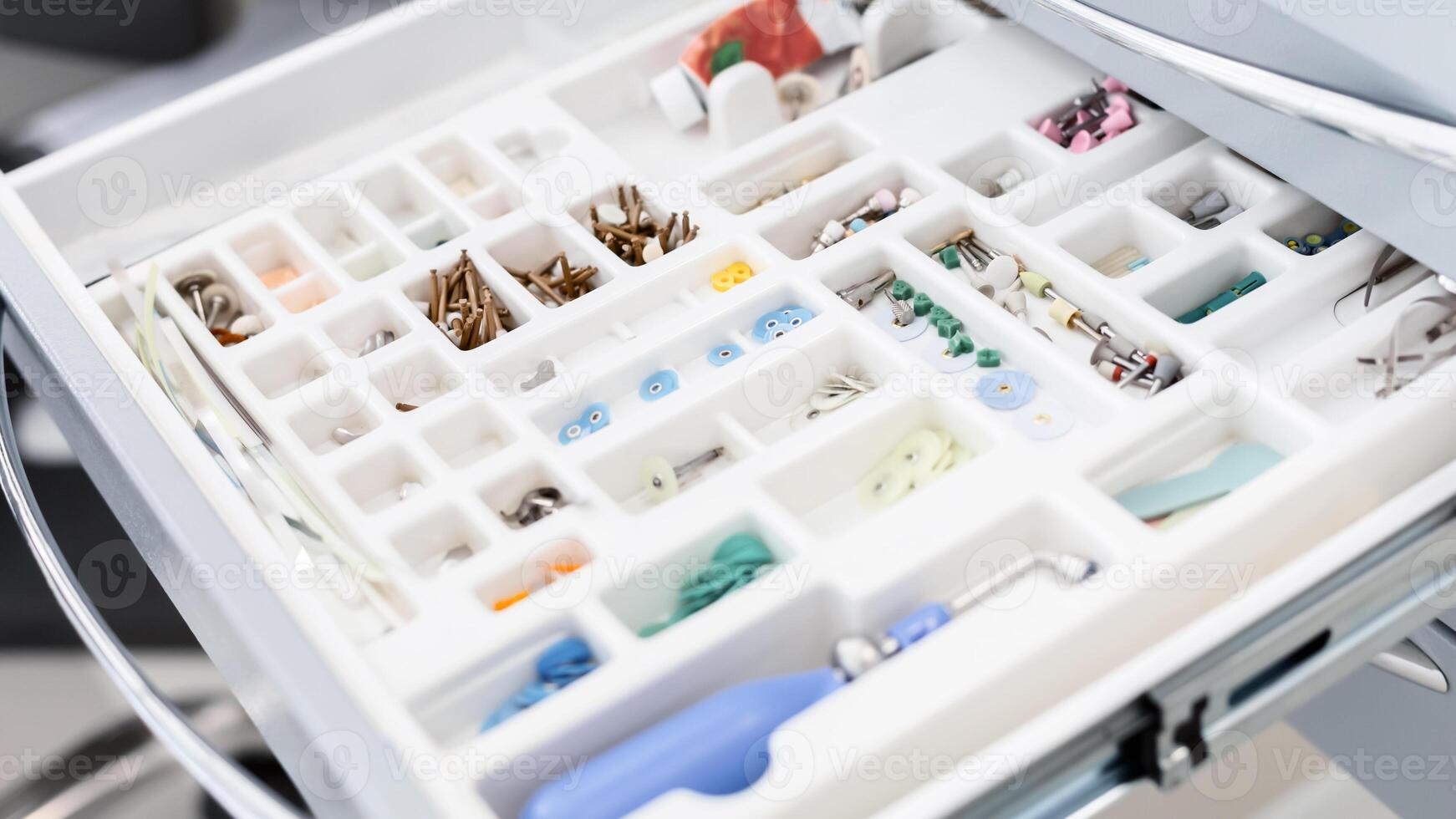 Close up of colorful dentist tools in open storage, dental equipment concept photo