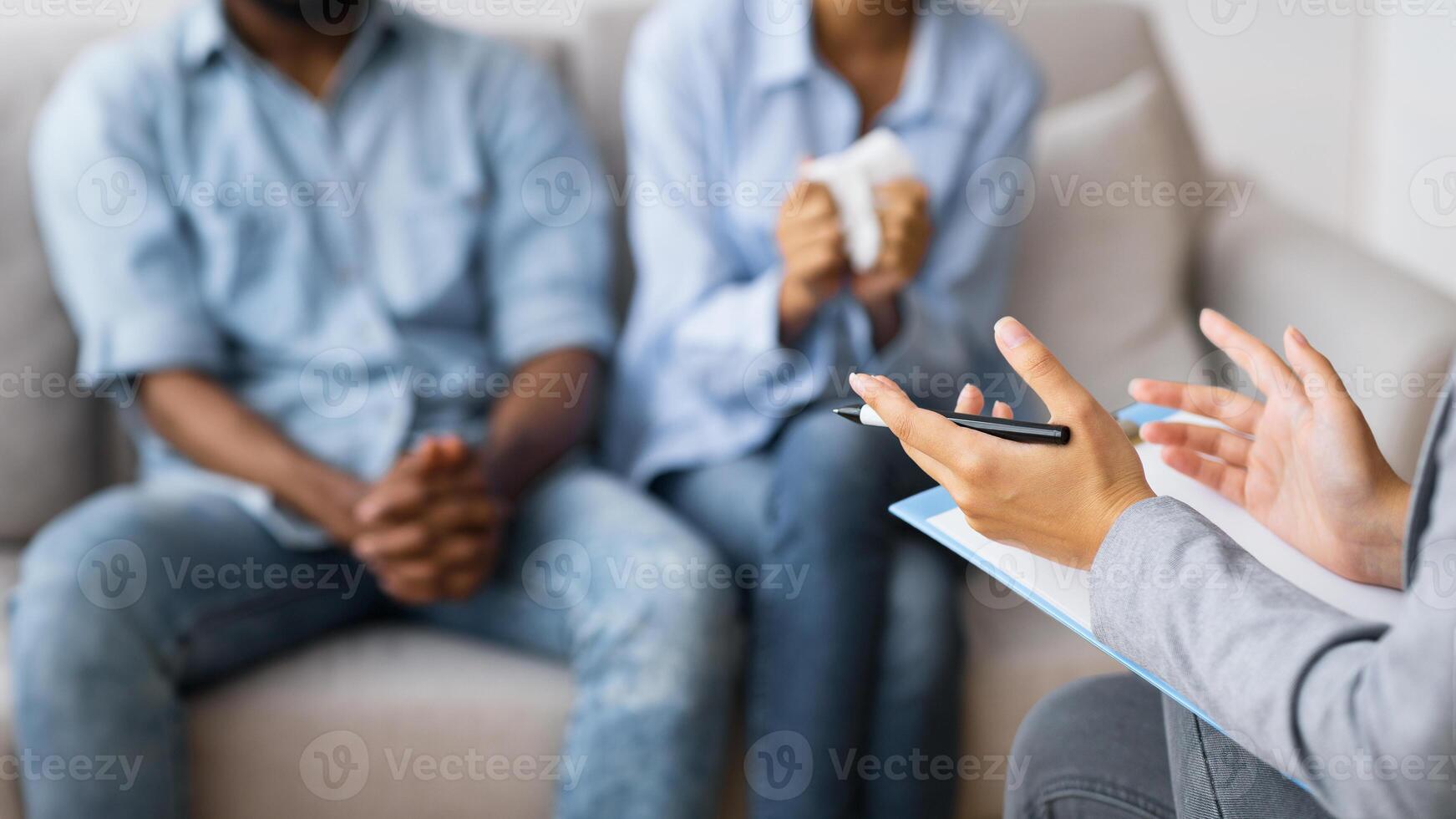 Save your marriage. Psychologist counselling young african american spouses. Shallow depth, copy space photo