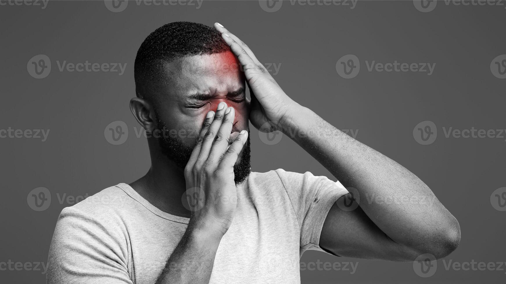 Sick black man having pain in forehead and nose, suffering from antritis photo
