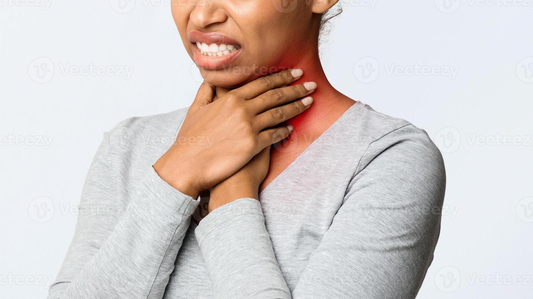 Angina, tonsillitis. Cropped of black woman holding her inflamed throat, panorama with free psace photo