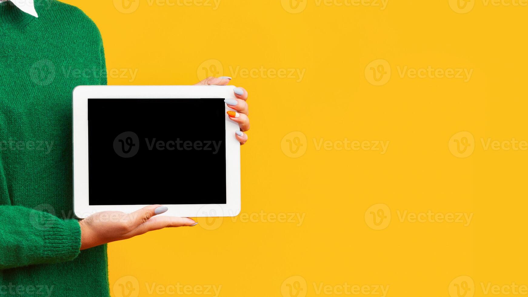 Useful Application Or Website. Unrecognizable afro teenager holding tablet with blank black screen, mock up, empty space photo