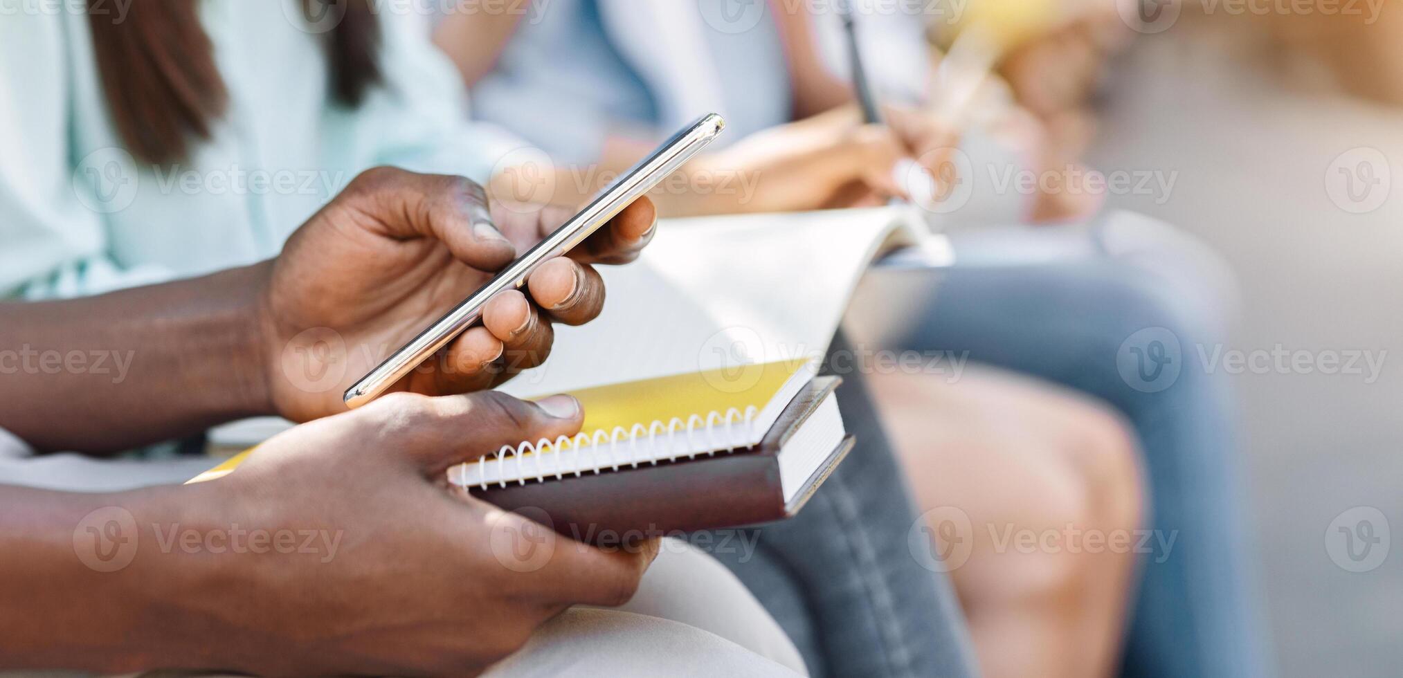 Online Education App. Modern Smartphone In Hands Of Unrecognizable African American Male Student, Cropped Image, Closeup photo