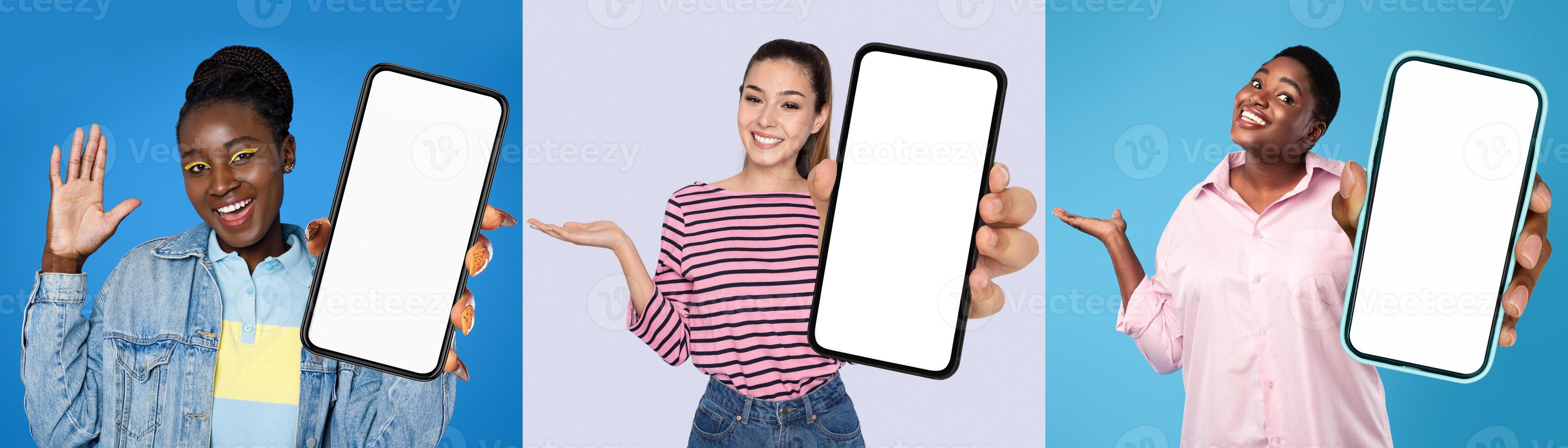 A focused group of multiethnic ladies standing closely together, each holding up a blank screen in front of them, mockup, copy space photo