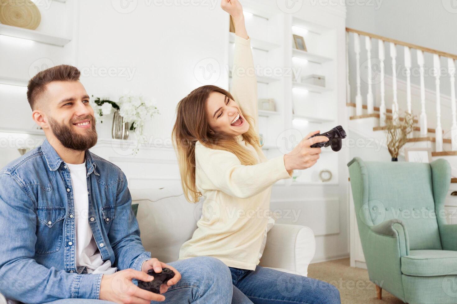 A man and woman are actively playing a game together, immersed in the virtual world on the screen in front of them. photo