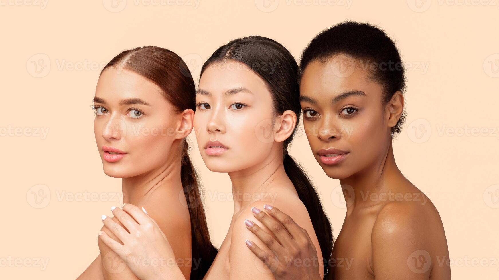 Natural Female Beauty. Three Attractive Girls Looking At Camera Posing On White Background. Studio Shot, Panorama photo