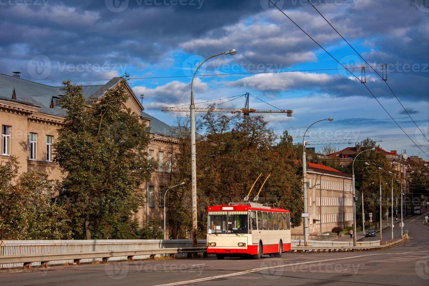 Old white-red trolleybus on the background of the building. Vilnius, Lithuania. photo