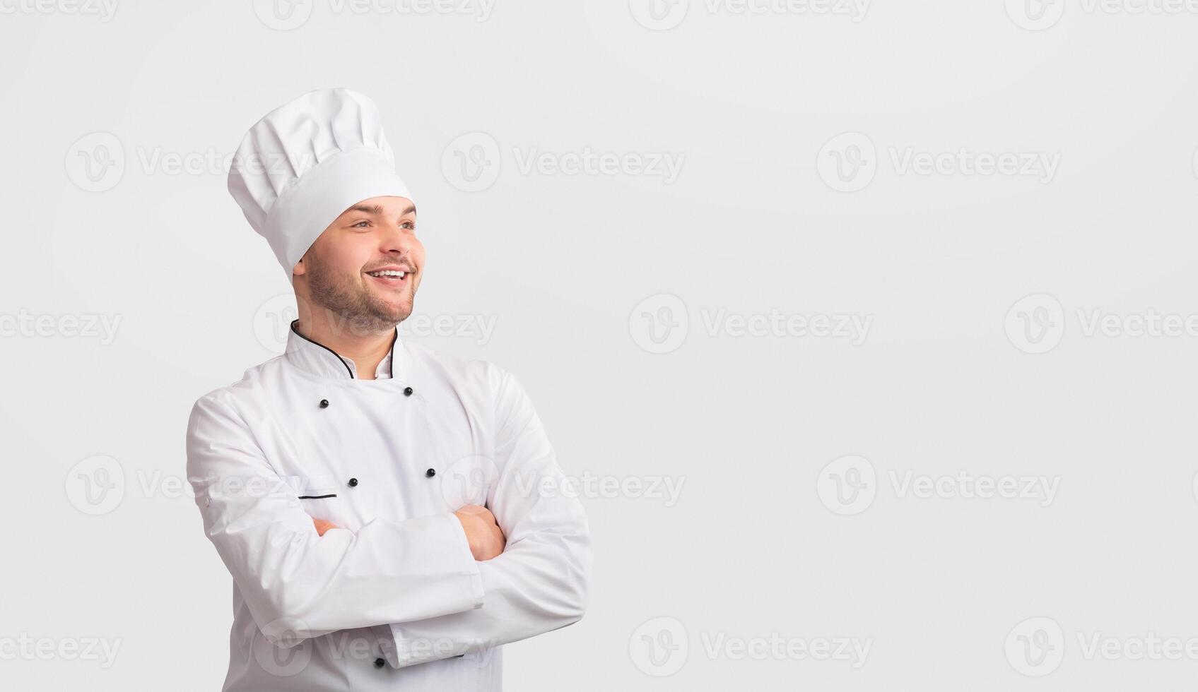 Successful Chef. Confident Cook Man Crossing Hands Looking At Copy Space Standing Over White Studio Background. Panorama photo