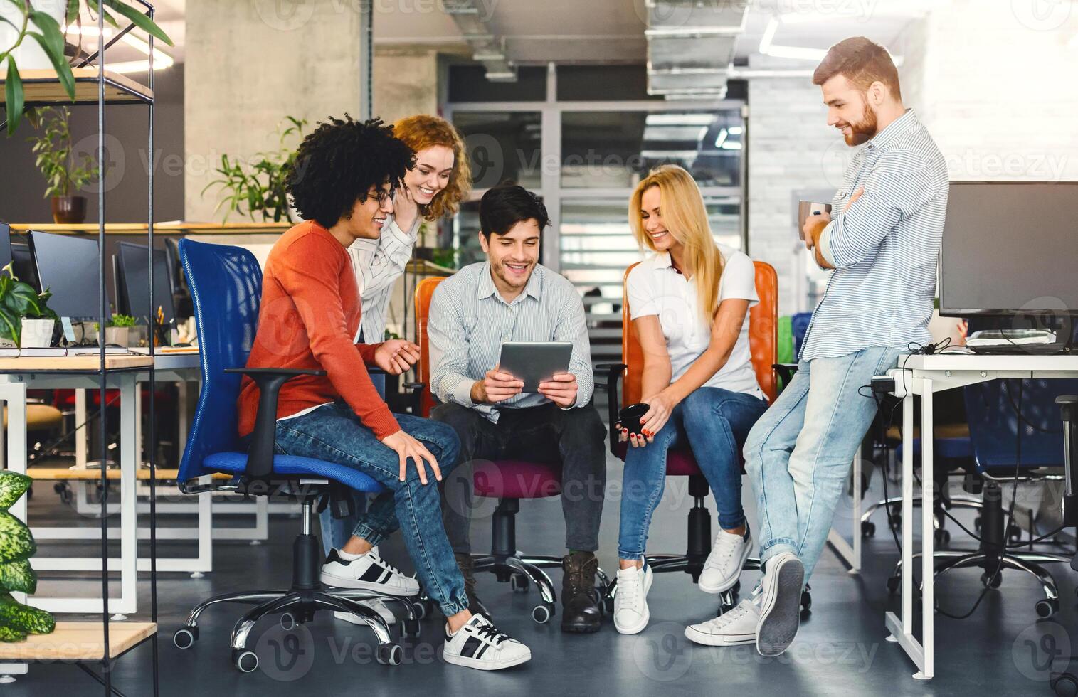 Team Brainstorming at Contemporary Office Table. Multinational team gathered around a sleek office table, actively brainstorming with enthusiasm and creative synergy filling the room. photo