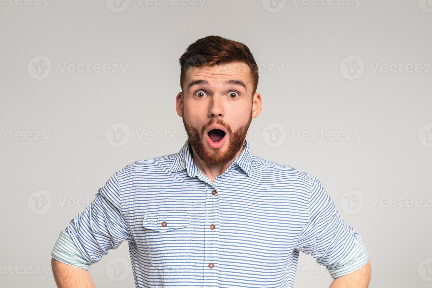 Astonishment and shock. Surprised man with shocked look on studio background, panorama photo