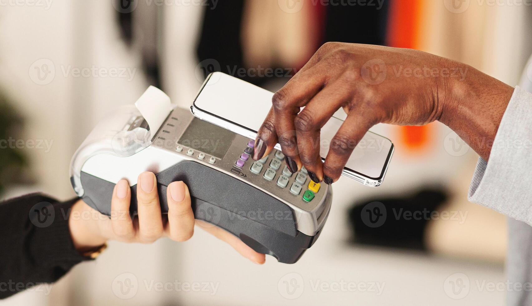 NFC technology. Woman making mobile payment with electronic reader, closeup photo
