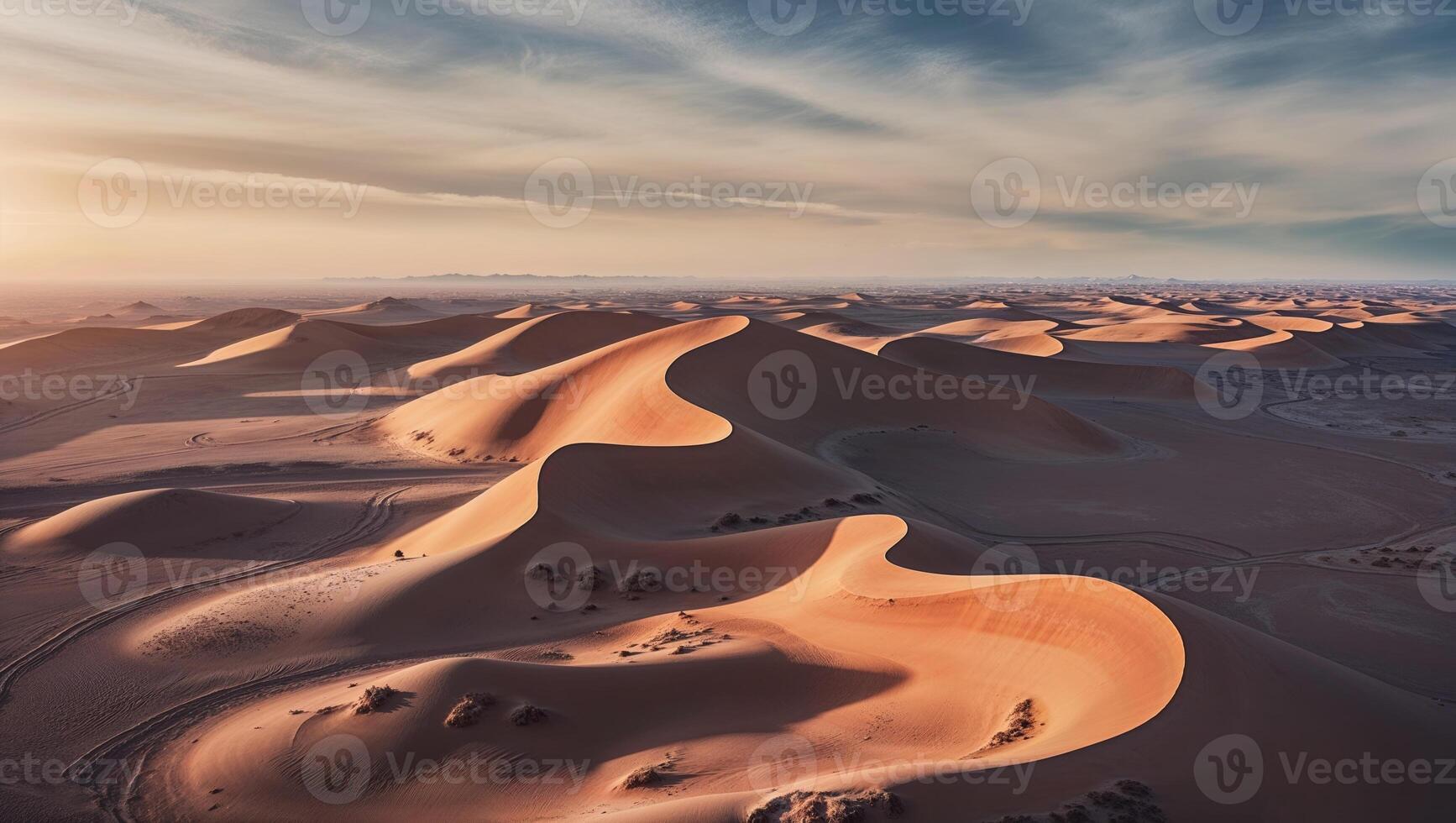 The sun is setting over the desert in the sahara photo