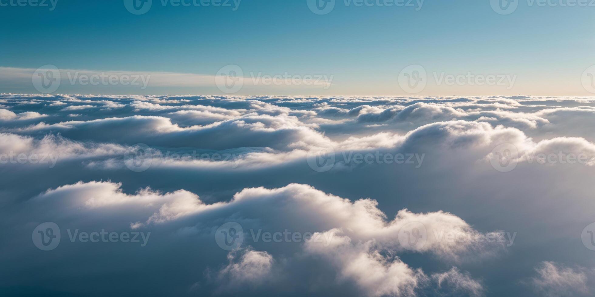 White fluffy clouds in a blue sky aerial view. photo