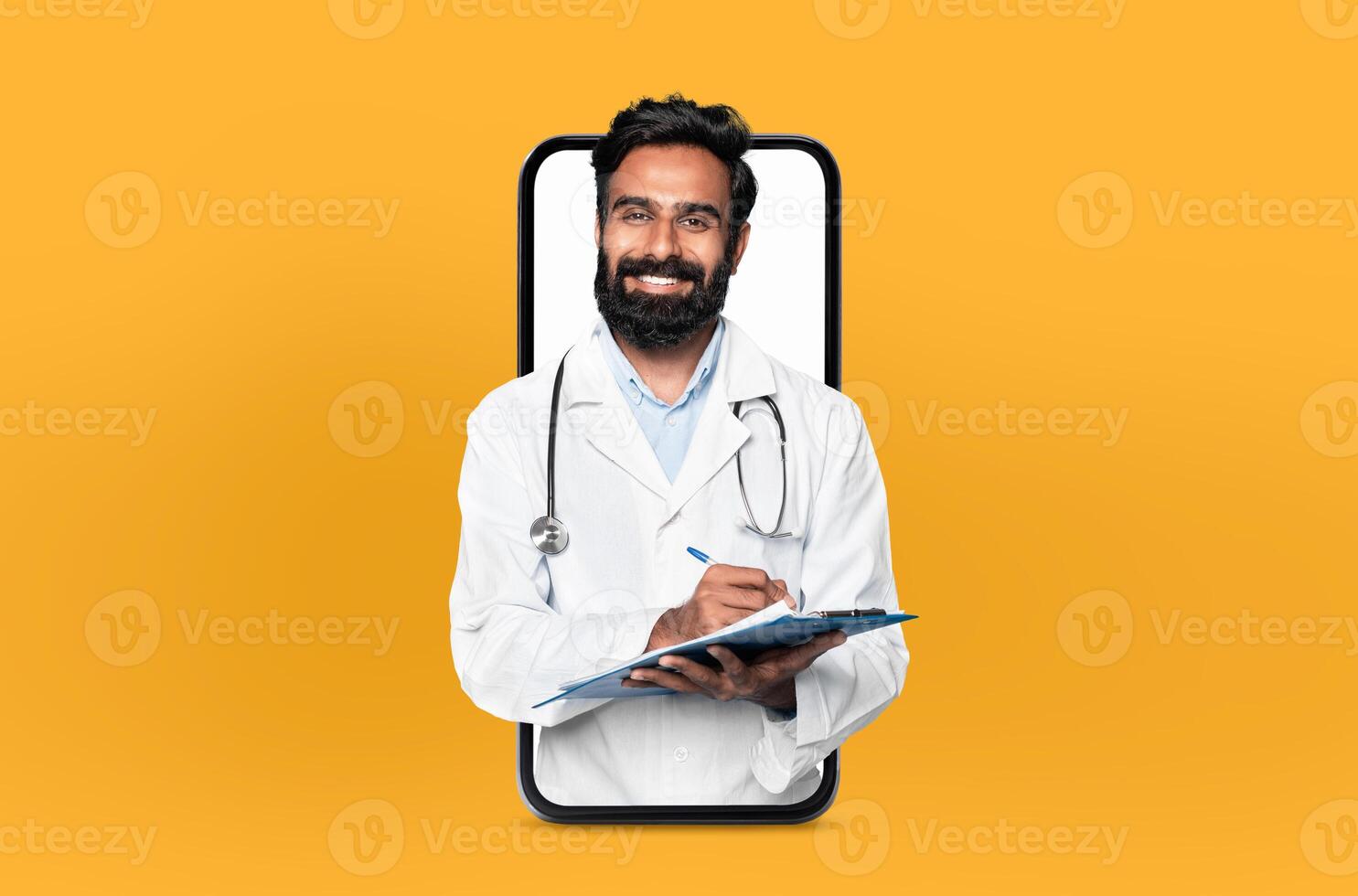 Smiling young eastern man doctor with a clipboard, presented within a smartphone frame, illustrating a user-friendly telehealth app interface photo