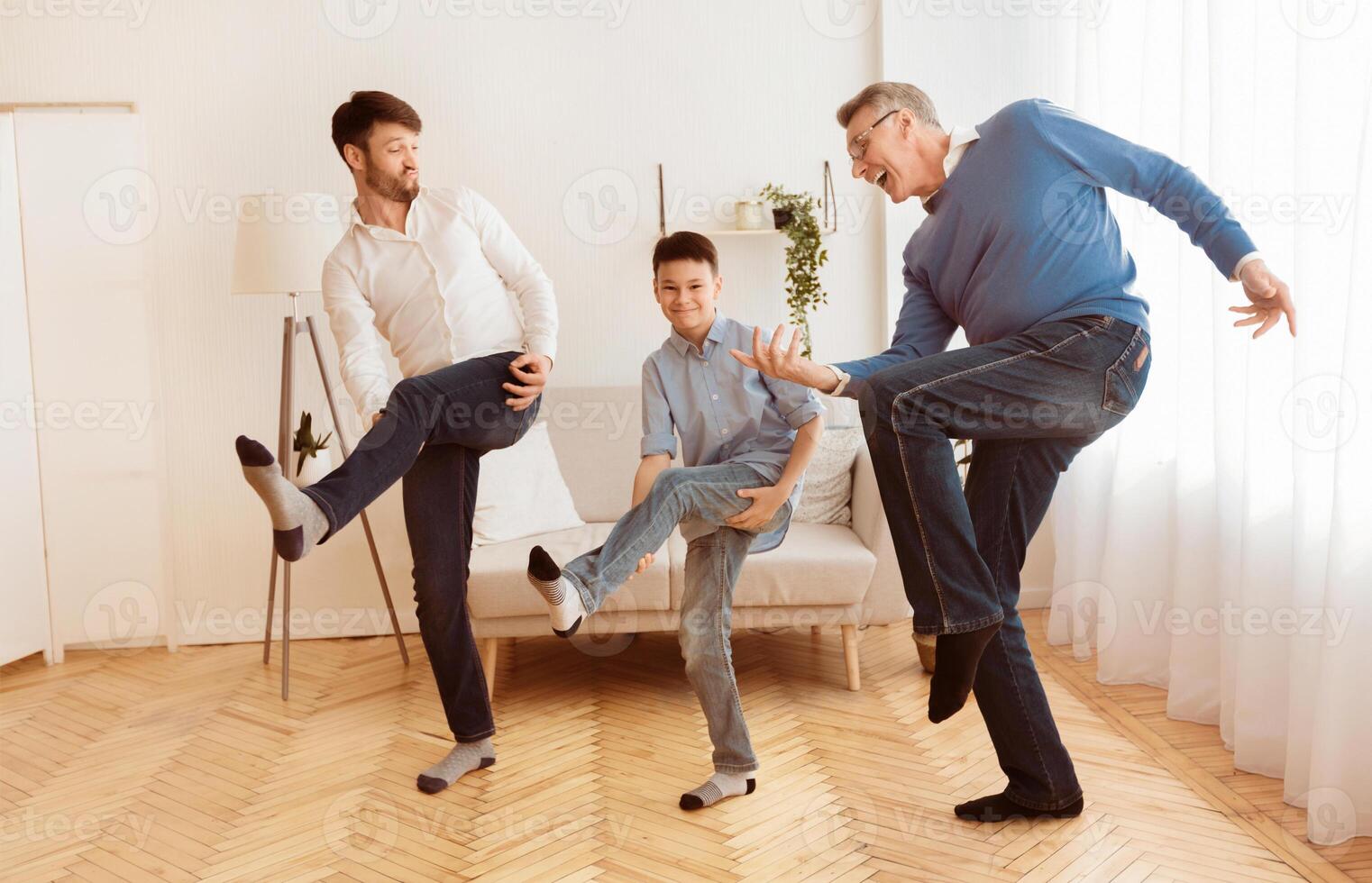 Happy Grandfather With Mature Son And Grandson Having Fun Pretending To Play A Guitar At Home. Multi-Generational Male Friendship photo