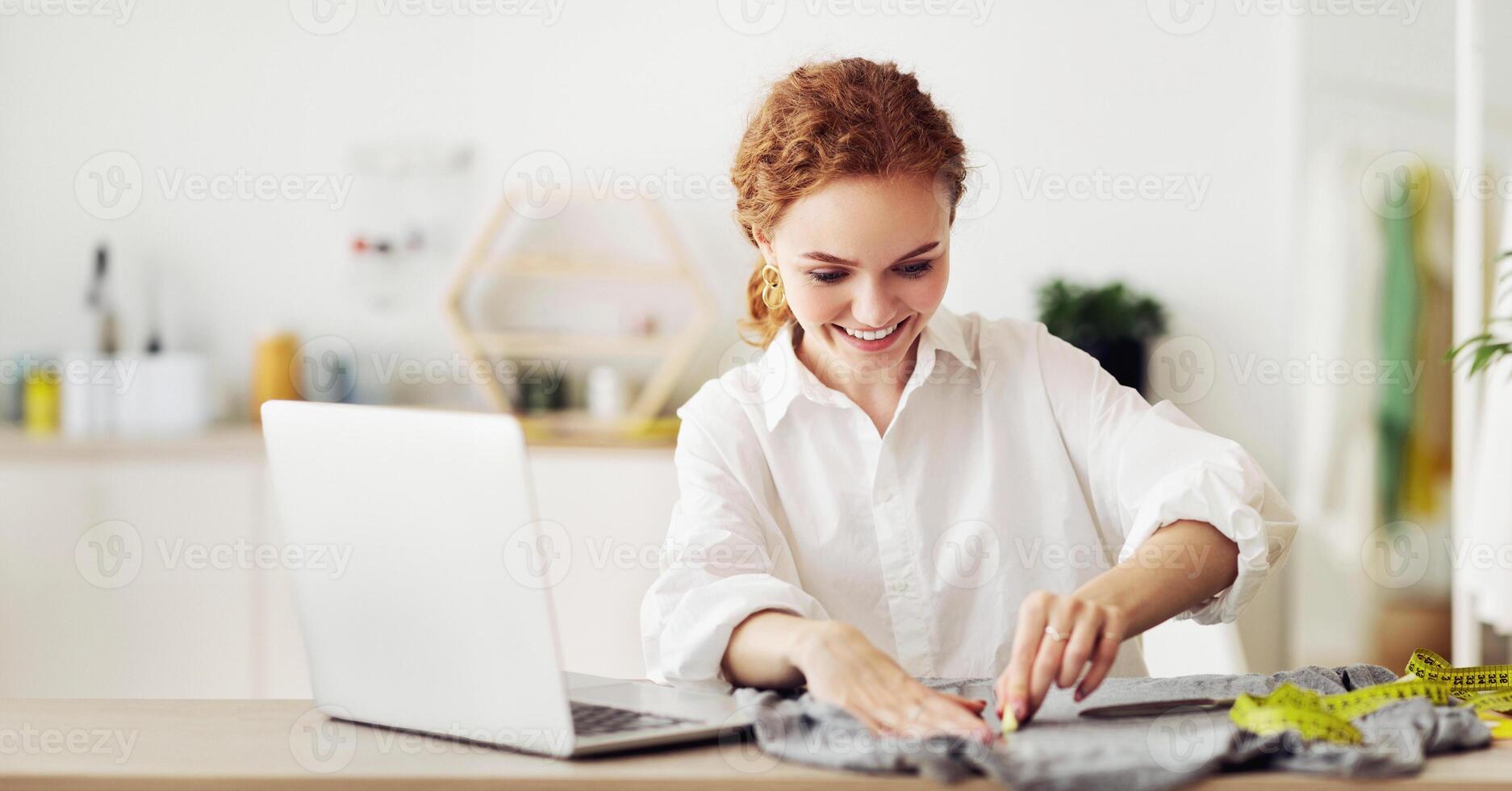 Atelier design studio. Woman is drawing markup patterns with soap on cloth, free space photo