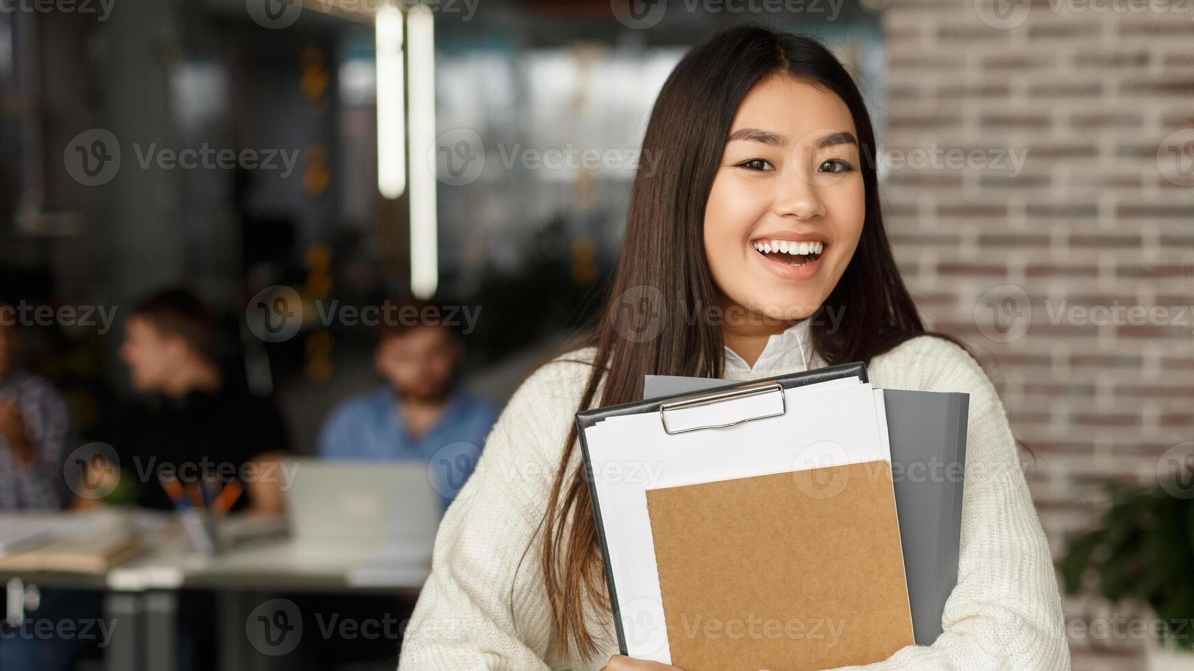 High school education. Happy girl in modern library smiling to camera, free space photo