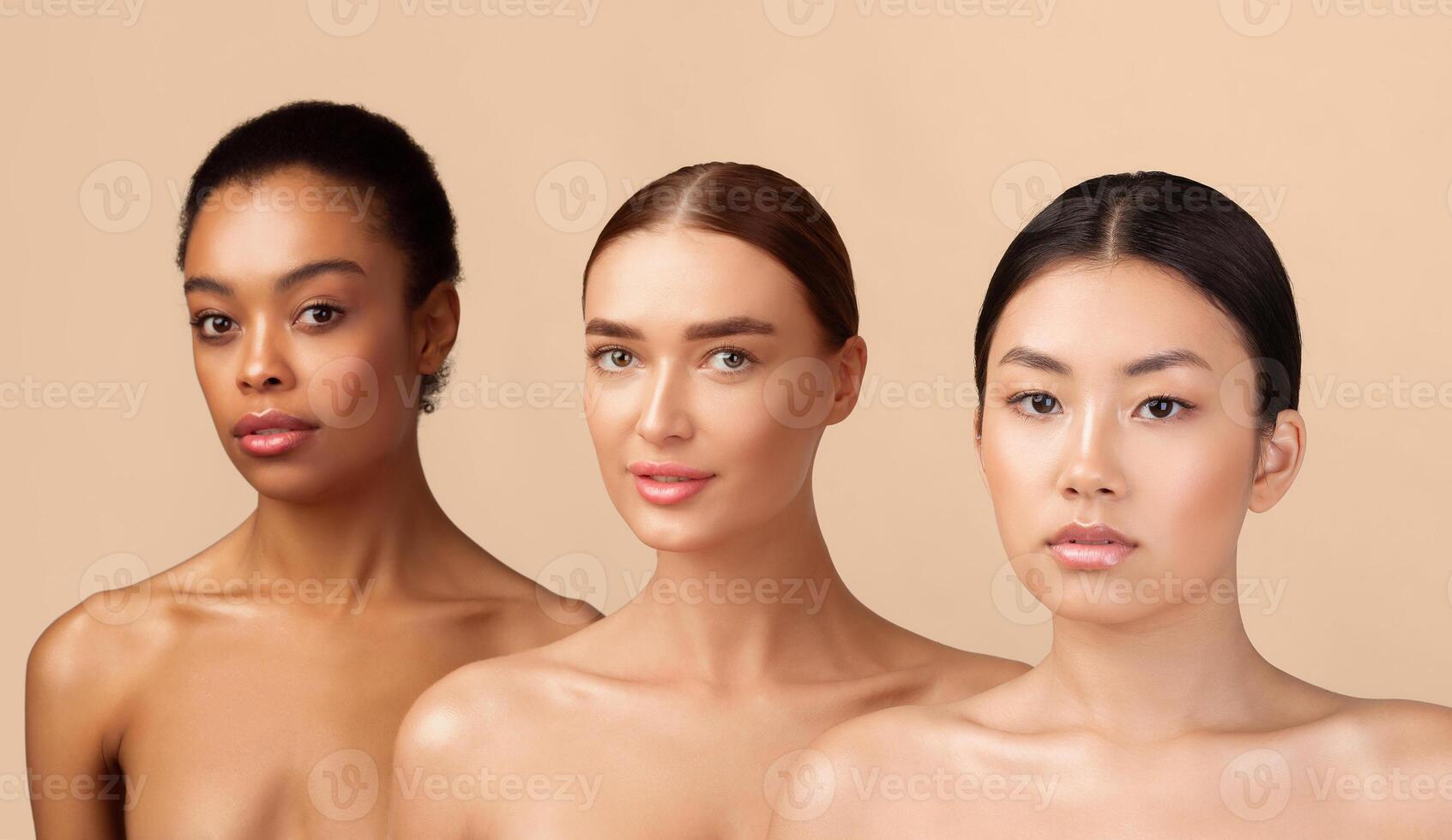 Three Attractive Women Models Posing Shirtless Looking At Camera Over Gray Background. Studio Shot. Beauty Diversity Concept photo