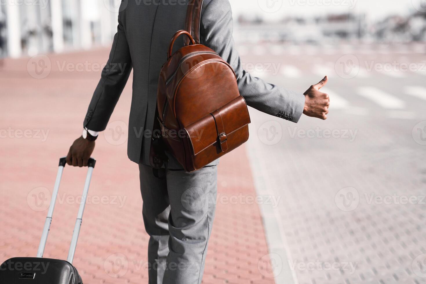 Business Executive Calling Cab At the Airport, Arriving from Trip, Crop photo