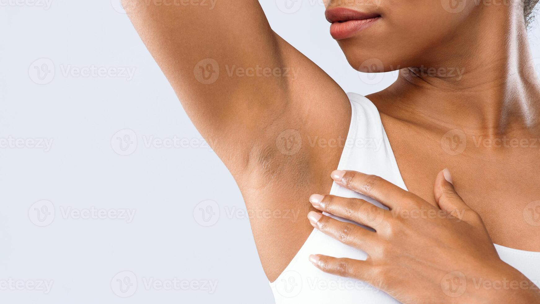 Cropped of black woman smelling her armpit, under arms hyperhidrosis, copy space photo
