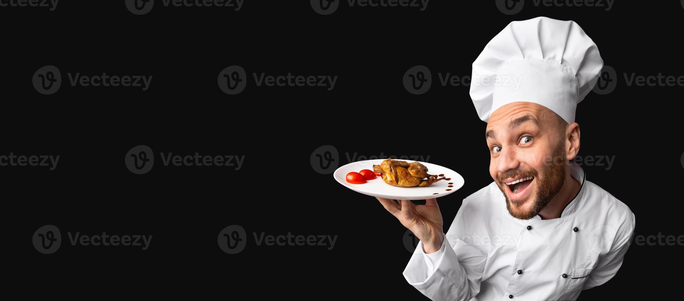 Bon Appetit. Excited Chef Holding Chicken Dish On Plate Standing On Black Studio Background. Panorama, Copy Space photo