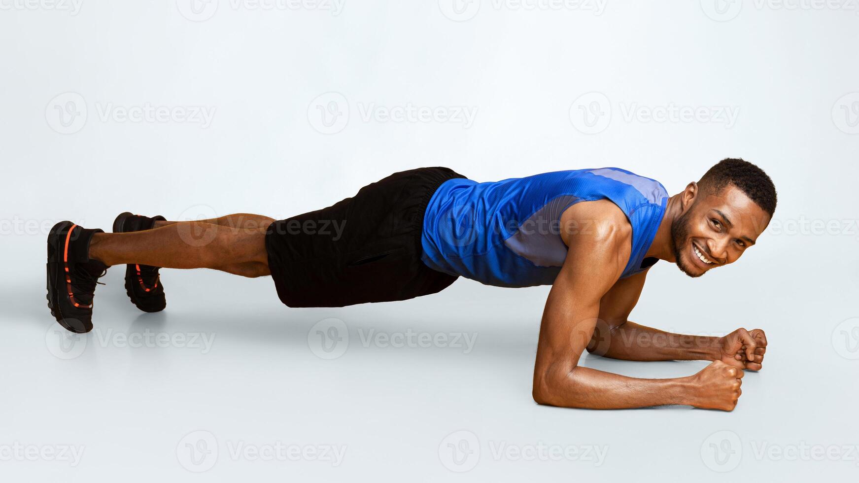 Sportive Black Man Doing Plank Core Exercise Training Back And Press Muscles, Full Length Panorama, Yellow Studio Wall photo
