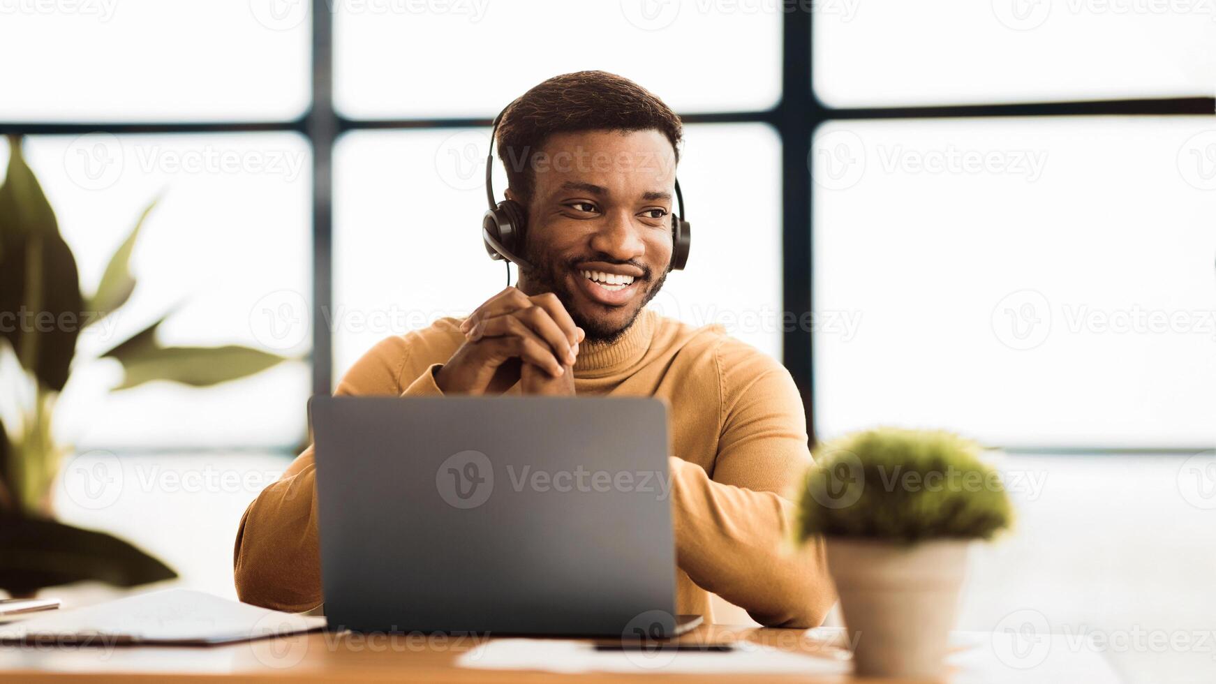 Hotline Support Service. Black operator in headset working in call center, panorama, copyspace photo