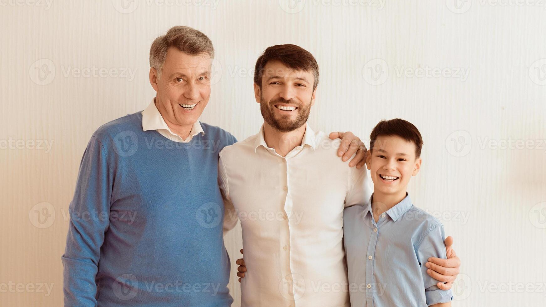 Happy Man Hugging Little Son And Senior Father Standing Over White Background. Multi-Generational Male Family. Panorama photo
