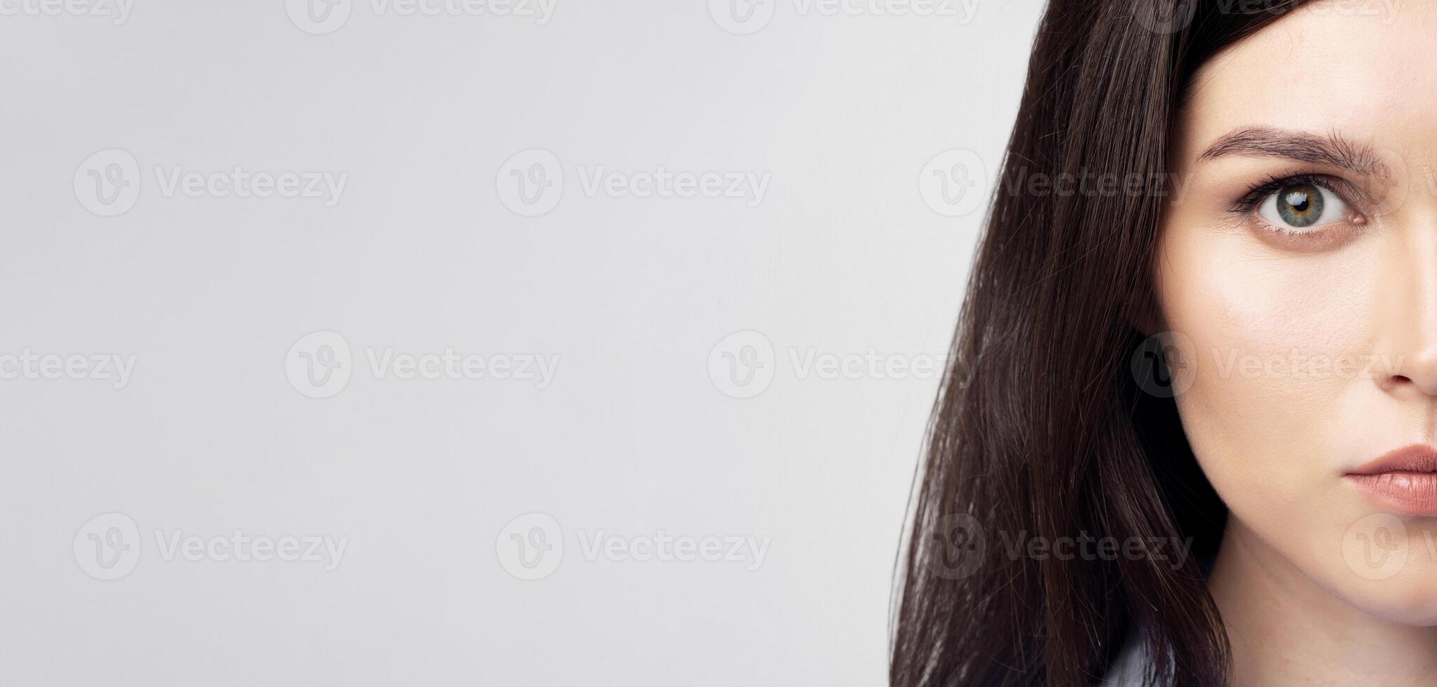 Portrait Of Woman Face Looking At Camera Over White Studio Background. Human Cloning And ID Data. Closeup photo